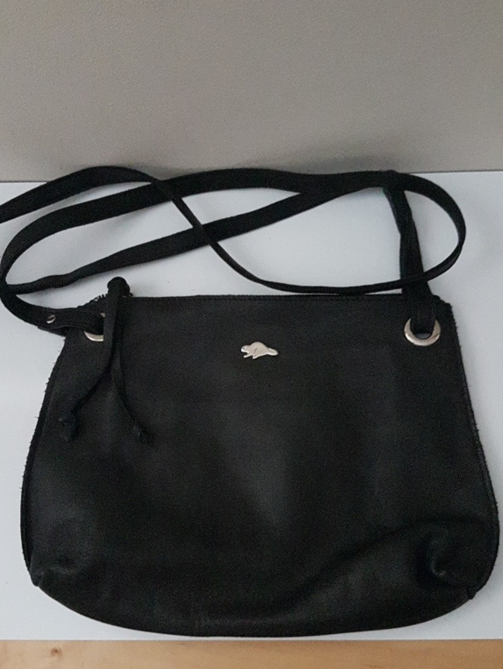 Roots Black Crossbody Bag with Silver Hare Emblem